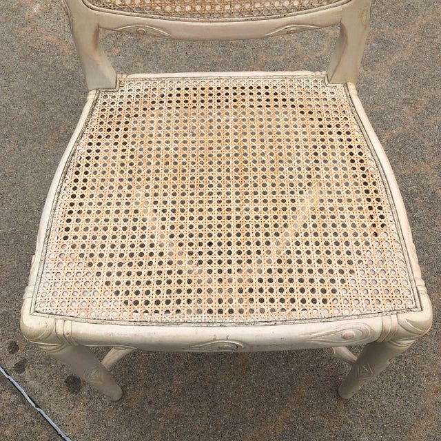 Beautifully carved white cane chair with twig details. Perfect for an accent chair