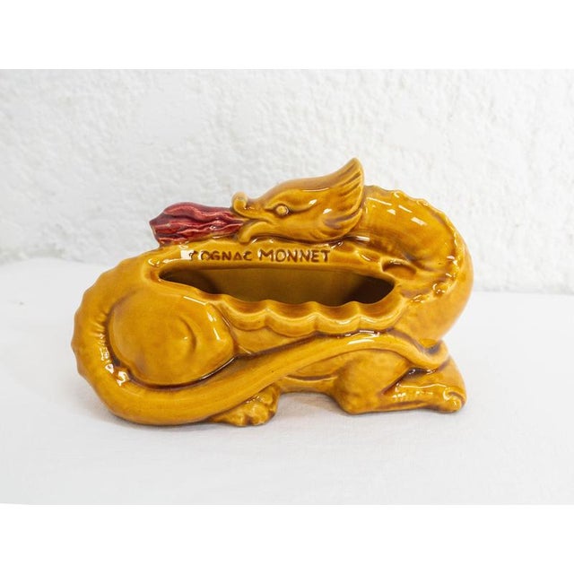 French advertising ceramic ashtray or empty pocket for Cognac Monnet, France, circa 1970. Since its founding in 1838,...