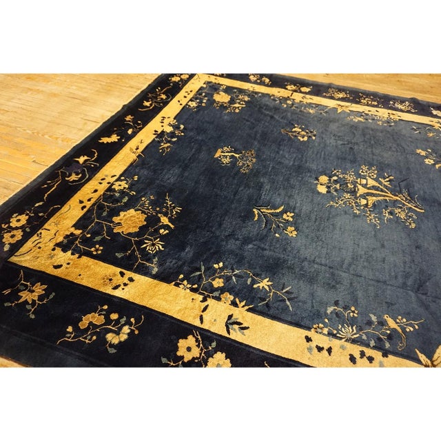 Chinese - Peking 1920s Blue Wool Knotted Antique Room Size Rectangle Rug, Circa Date: 1920s. This exceptional example of...