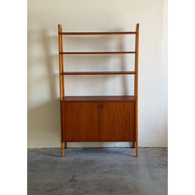 Beautiful vintage Swedish mid-century modern wall unit in style of Gillis Lundgren, one of IKEA’s early and most...