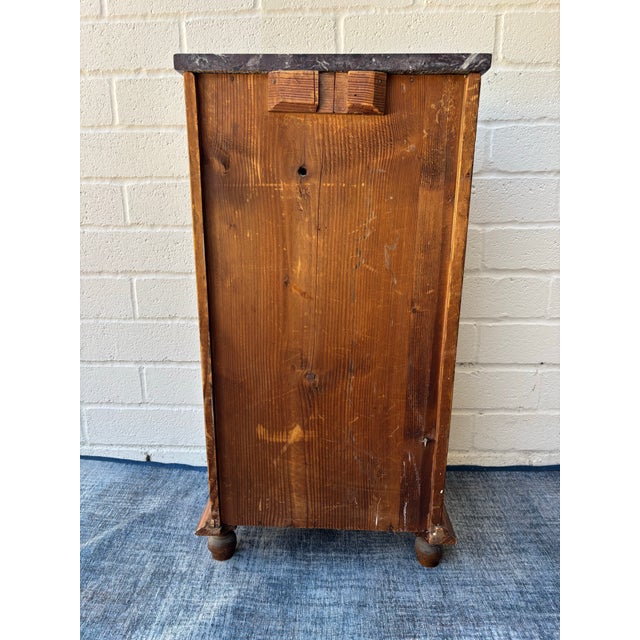 Antique walnut nightstand / bedside cabinet featuring a dark marble top and a single drawer above a cabinet door. Great...