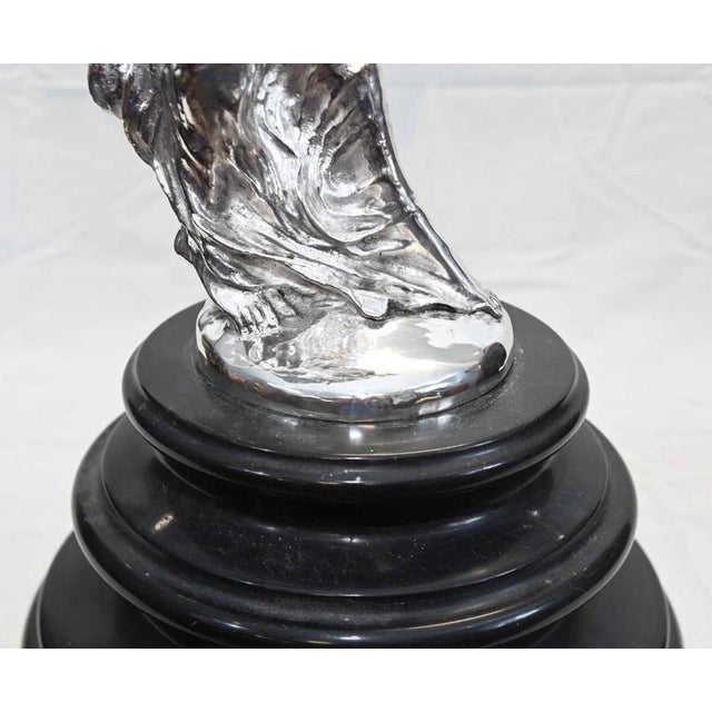 Impressive large silvered sculpture of the iconic Spirit of Ecstasy after the celebrated design by Charles Robinson Sykes...