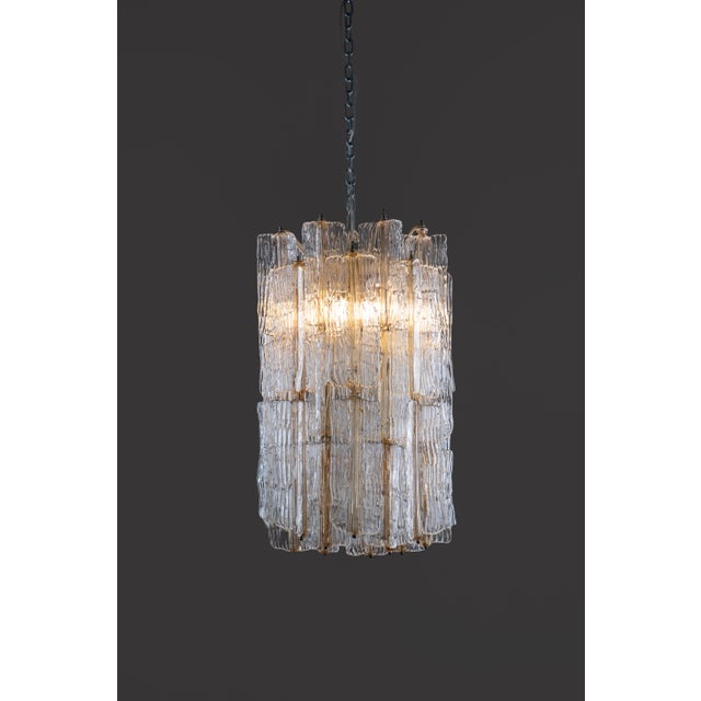 Rare italian murano glass chandelier by venini 1960s. Original signature present. The lamp has a metal white structure...