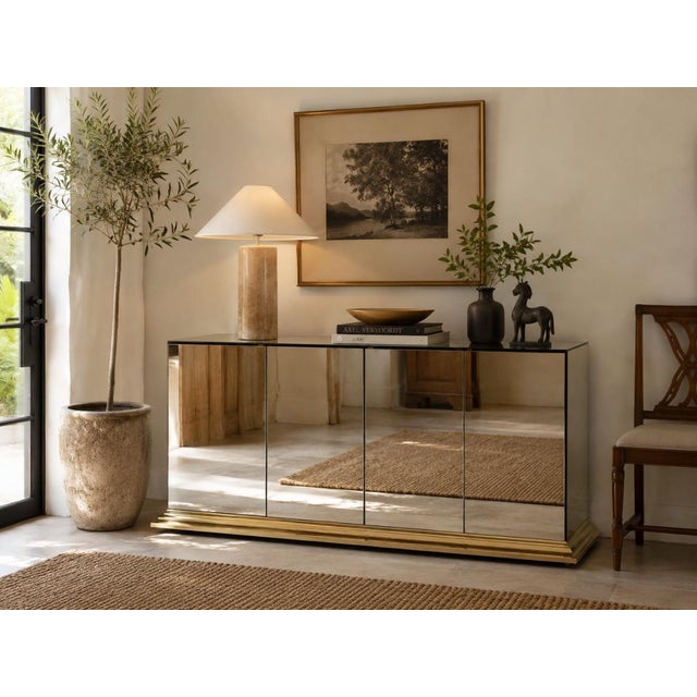 Glamorous 1970s vintage sideboard by Ello Furniture, featuring mirrored glass panels throughout and a striking polished...