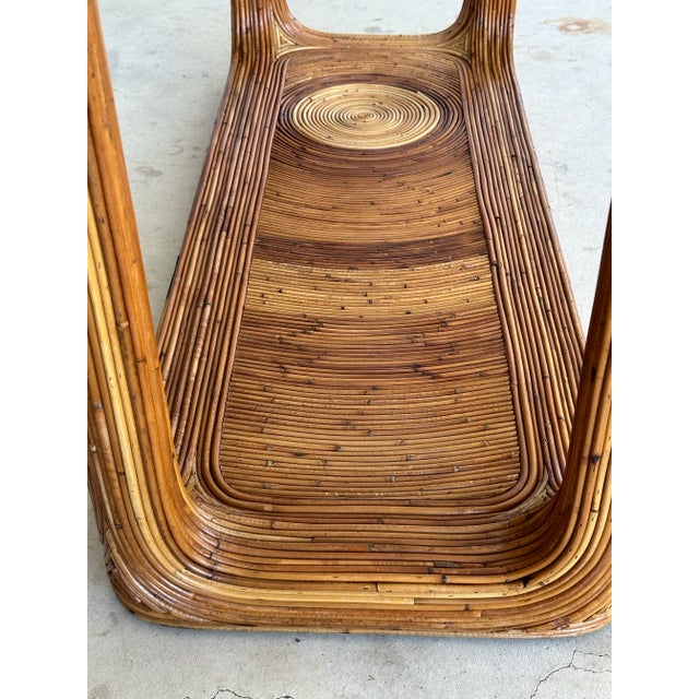 A showstopper from every angle. This monumental vintage étagère is crafted from layers upon layers of stacked pencil...