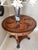 This table is absolutely a work of art. This spectacular piece is The Theodore Alexander Swirling Teardrops table. It is a...