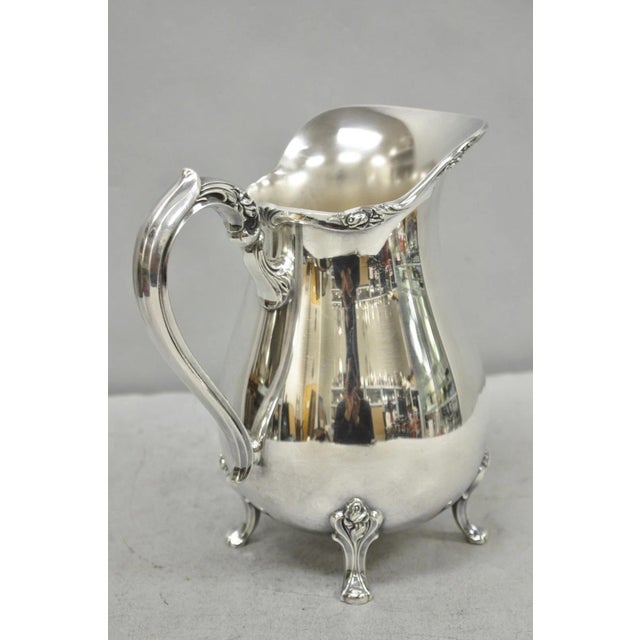 Vintage Webster Wilcox "Sylvia" Silver Plated Bulbous Footed Water Pitcher. Circa Mid 20th Century. Measurements: 8.75" H...