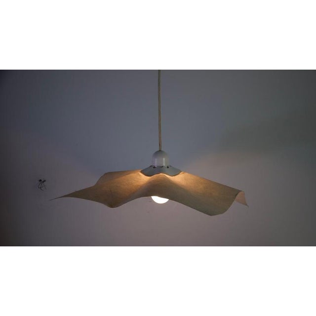 This iconic area 50 pendant lamp, designed by renowned italian designer mario bellini for artemide in 1974, is a true...