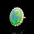 A striking cocktail ring featuring a captivating black opal weighing 8.38 carats. The opal is cut in an elegant oval...