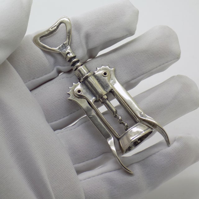 Vintage solid silver miniature figurine depicting a traditional lever corkscrew with moving parts, crafted in Arezzo,...