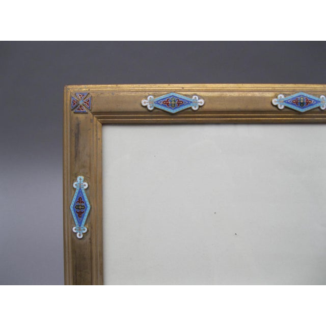 Pair of neo gothic gilt bronze frames. Decorated with {cloisonné} enamel in blue, red and green; trilobed diamond shape...