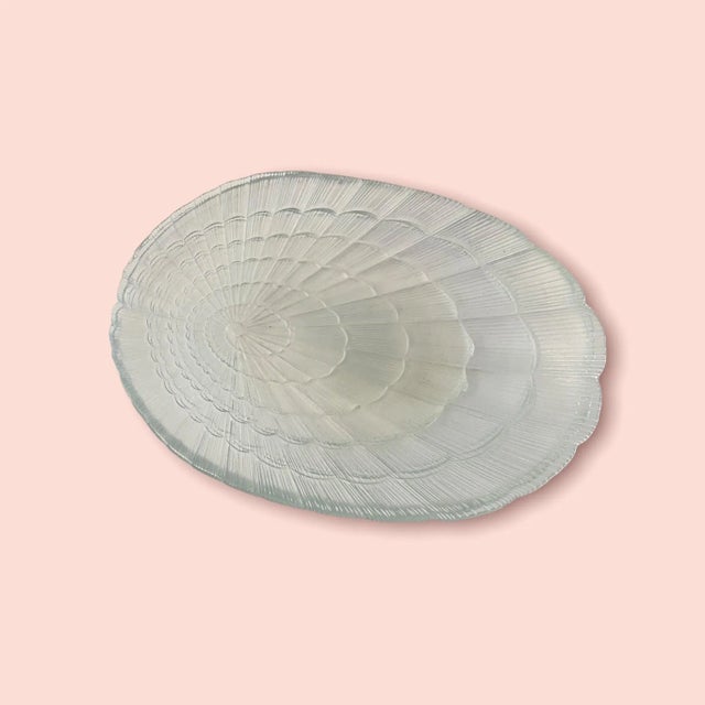 Set of four vintage French Arcoroc glass seashell dinner plates or serving platters. Photographed the plates against...