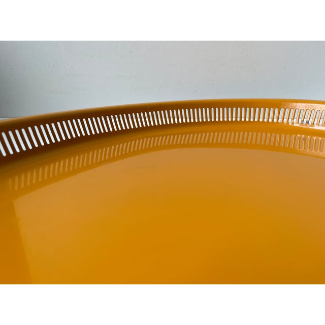 A large oval serving tray for kitchen, bar or living room use. It is made from enameled steel and features a stylish...
