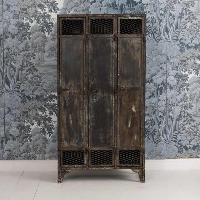 A beautiful piece of history! Metal lockers from a slate mine in France with nicely aged patina. Three full length doors...