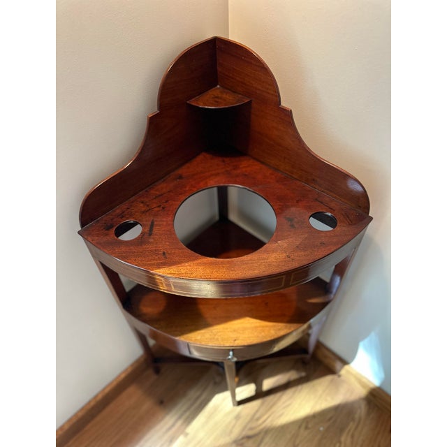 This beautiful American mahogany corner washstand, dating to circa 1800, was professionally appraised in 2021 for $1,500....