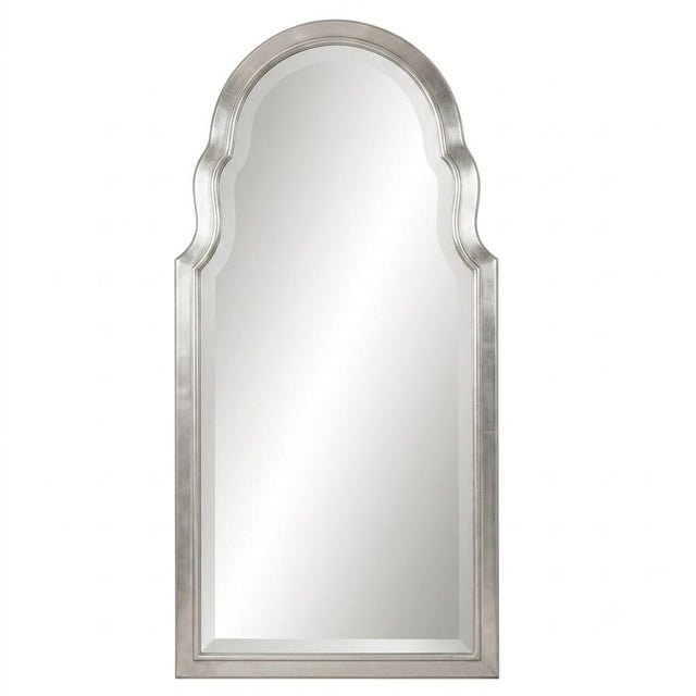 The Arthingtontyne is a tall, softly arched mirror finished in classic silver  an architectural piece that pairs...