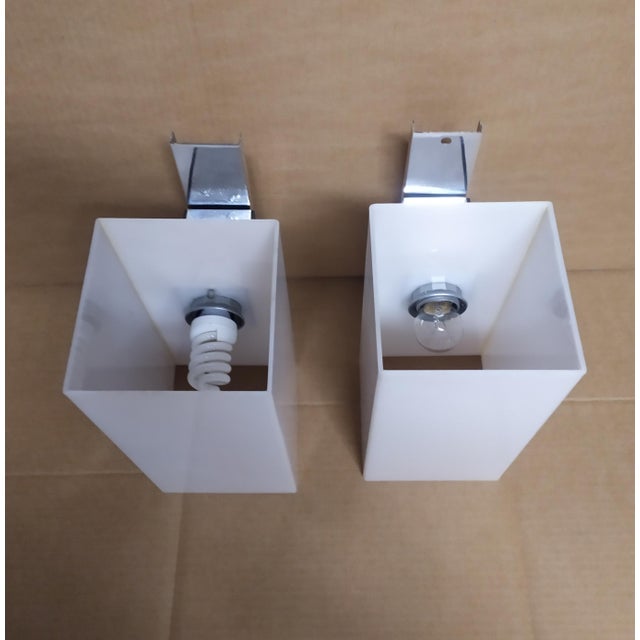 These two Arredoluce Wall lights are attributed for form and style. No logo and Mark. This piece is attributed to the...