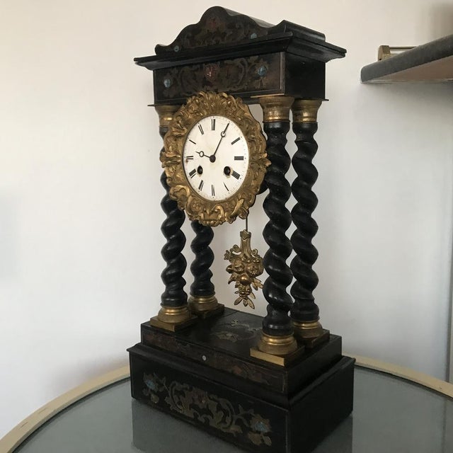 Antique pendulum clock of Napoleon III Historical project Napoleon III's pendulum clock Made of wood, inlaid and spiral...