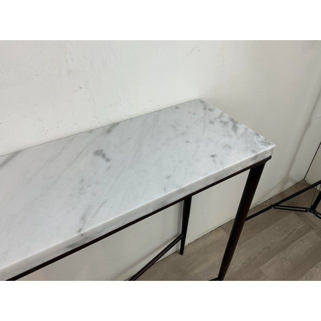 Stylish Contemporary Carrara Marble Console Table, black metal base, showroom floor sample