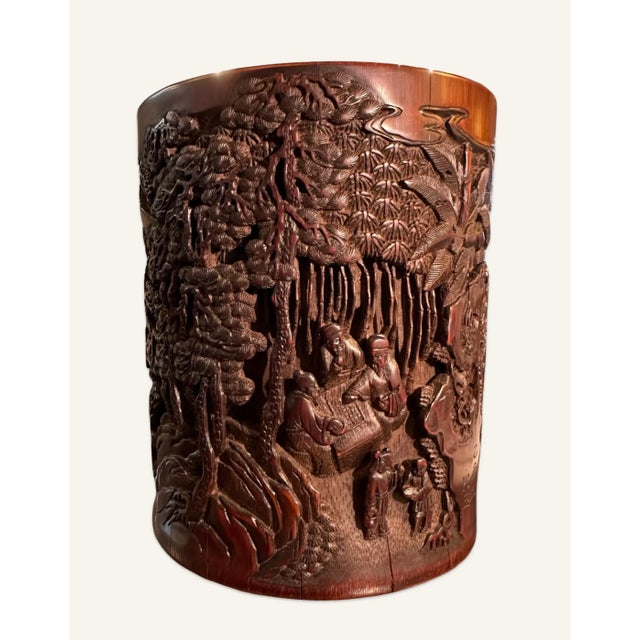 This Chinese brush pot is carved in high relief and depicts a rural scene (often presented with symbolism of longevity)...