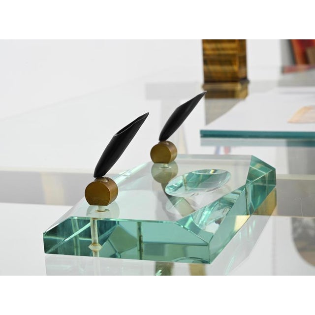 Marvelous pen holder in Nile green beveled crystal and solid brass, produced by Fontana Arte in Italy during the early...
