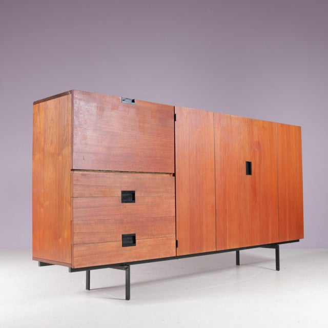1950s Japanese series cabinet CU08 by Cees Braakman, produced for Pastoe in the Netherlands, reflects Braakman’s...