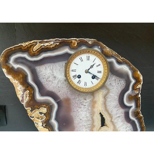 "Pendulum encrusted in an agate stone" old pendulum encrusted in a slice of agate enclosed in a brass base it lacks the...