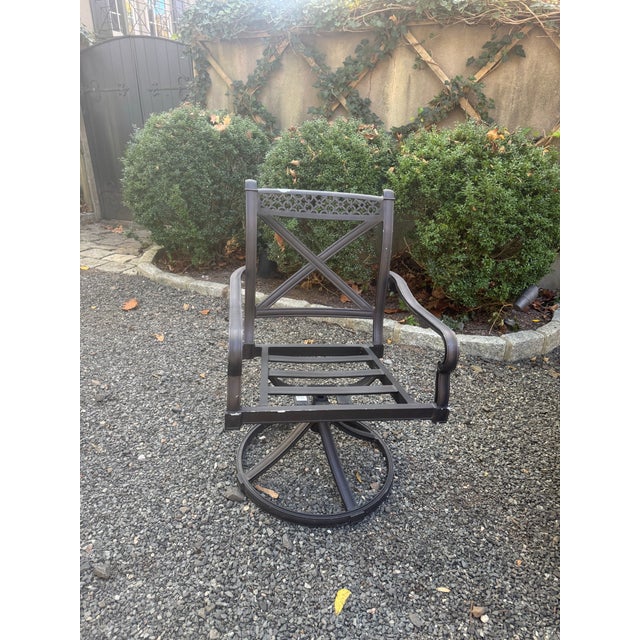 Seven piece vintage outdoor dining set in aluminum. The two head chairs swivel while the remaining four do not. No...
