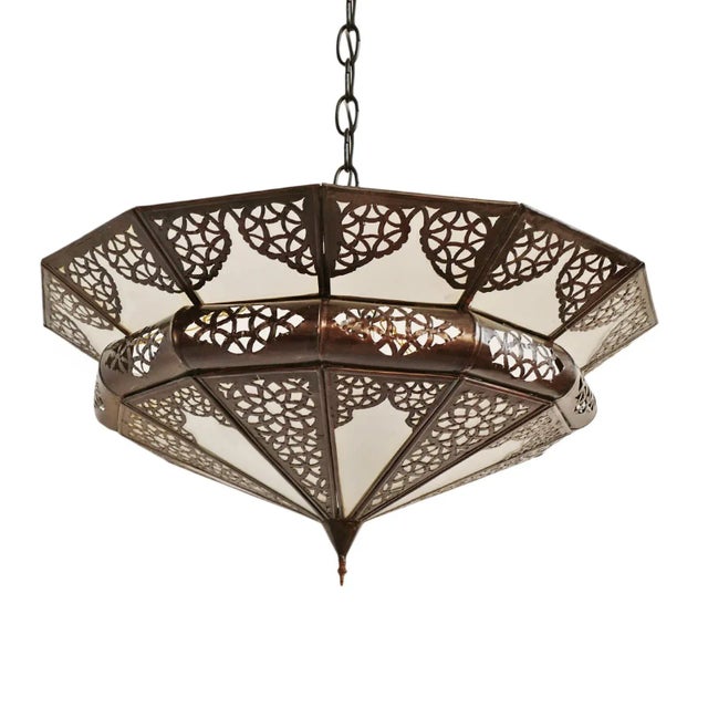 Vintage hand cut metal work chandelier with white frosted glass. Low profile makes this lamp useful for low ceilings. Each...