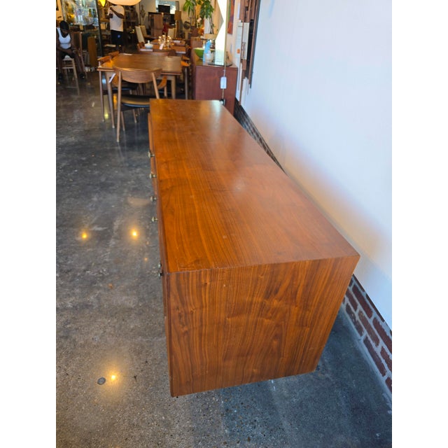 The Drexel Declaration lighted sideboard by Kipp Stewart is a beauty. I love that they didn't stain the wood so it remains...