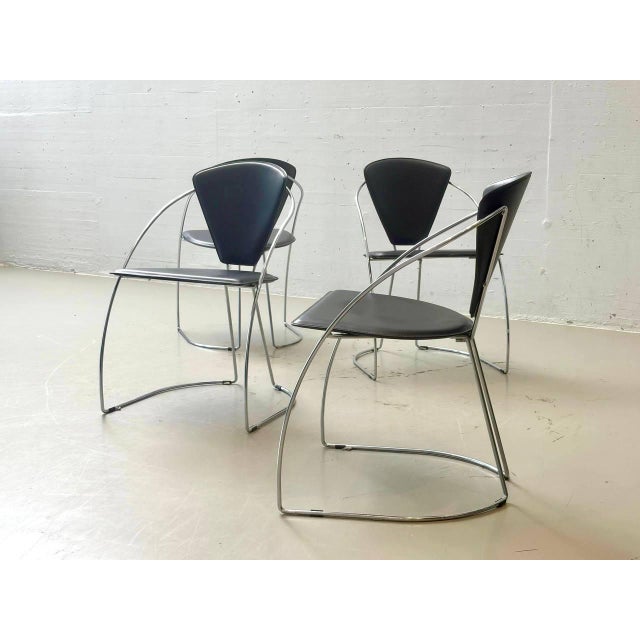 Four elegant vintage linda dining chairs from the 1980s, designed by lo studio and a. Rizzatto. The design combines the...