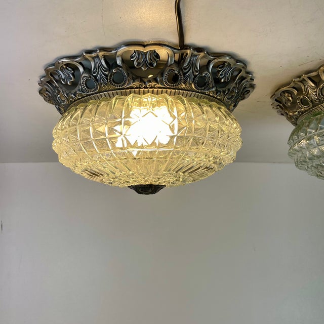 Nicely made ceiling lamp, flush mount, in openwork decorative patinated silver metal, with a clear cut-glass dome and a...