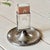 Magnificent 20th-century silver-plated pedestal matchbox holder from Hotel Celine featuring a stately engraved shield...