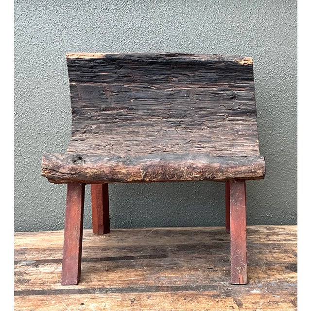 This exceptional primitive wood chair is a masterwork of organic design, bridging the gap between functional furniture and...