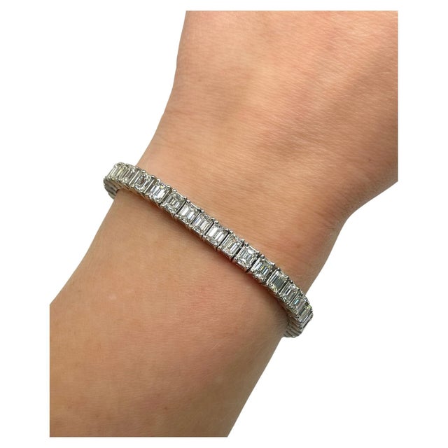 This super classic bracelet contains 45 emerald cut diamonds weighing approximately 14.00 carats total. Crafted in...