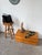 A 1900s folk art or brutalist sculpture carved from a single piece of wood, depicting a church. we love the wood's patina,...