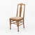 An American T back side chair in solid hardwood, made in the early twentieth century. The back is built around a single...