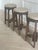 Elevate your space with this set of 3 Pierre Jeanneret-style teak stools, inspired by the iconic mid-century Chandigarh...