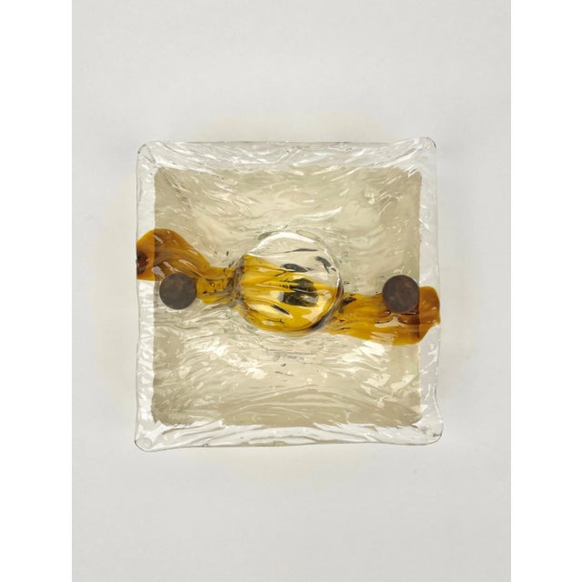 Wall lamp sconce in white and amber murano glass by the Italian designer Toni Zuccheri for Venini. Made in Italy in the...