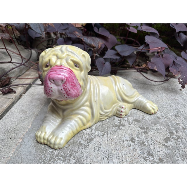 A charming and unusual vintage Chinese ceramic Shar Pei dog figurine, finished in a pale yellow celadon glaze with...