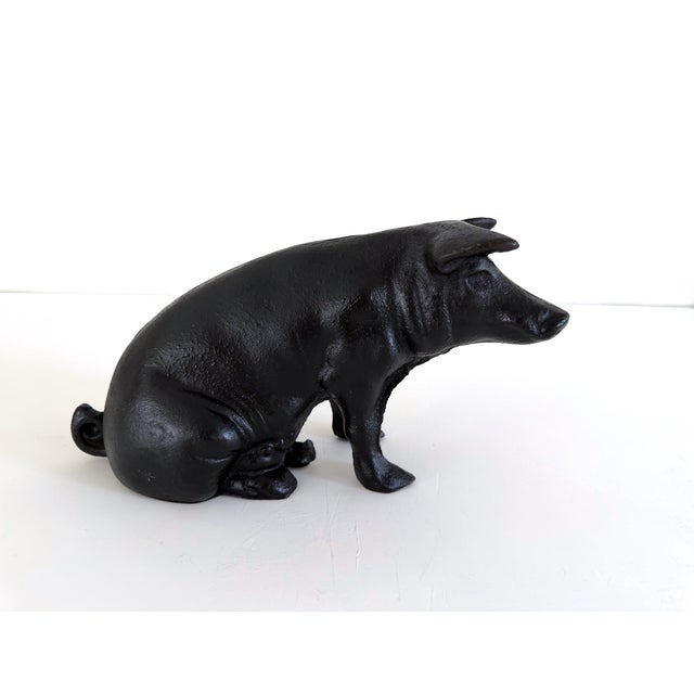 Wonderful antique cast iron pig bank or doorstop. Great rustic or farmhouse item. Coin slot is on the upper back, and the...