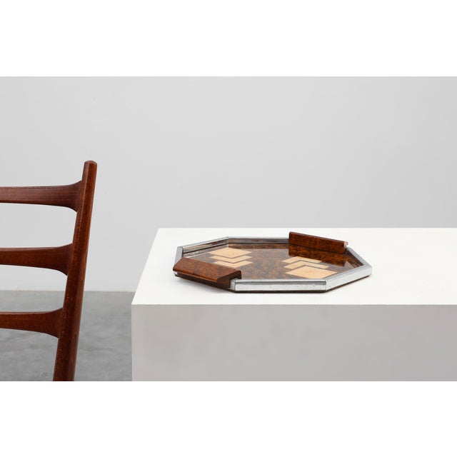 A striking Belgian Art Deco whiskey tray from the 1920s, combining geometric precision with rich material contrast. The...