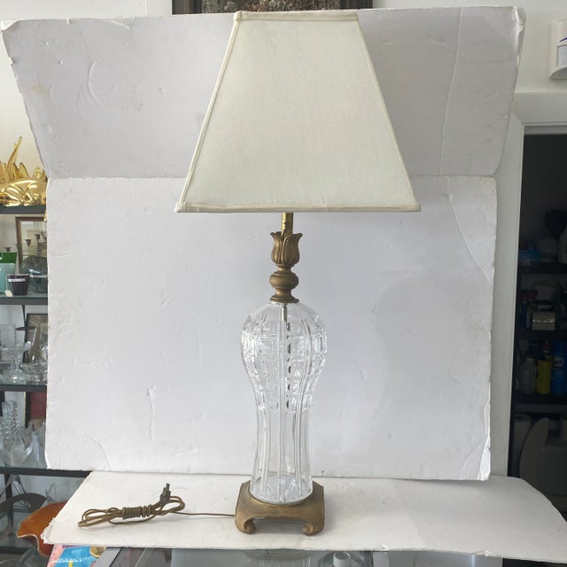 Traditional lamp with a modern crystal design and brass accents will go well in all upscale interiors. Made by Safran and...