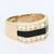 This striking signet ring is a bold statement piece. Crafted in 14k yellow gold, it features a sleek black trapezoid stone...