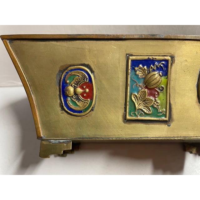 1930s Chinese enameled brass small planter, flared form resting on four bracket feet. Marked "China" on the bottom.