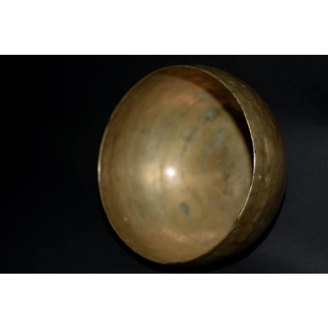 A rare 19th century Tibetan singing bowl. The hand made piece is all original, hand hammered yielding a subtle overall...