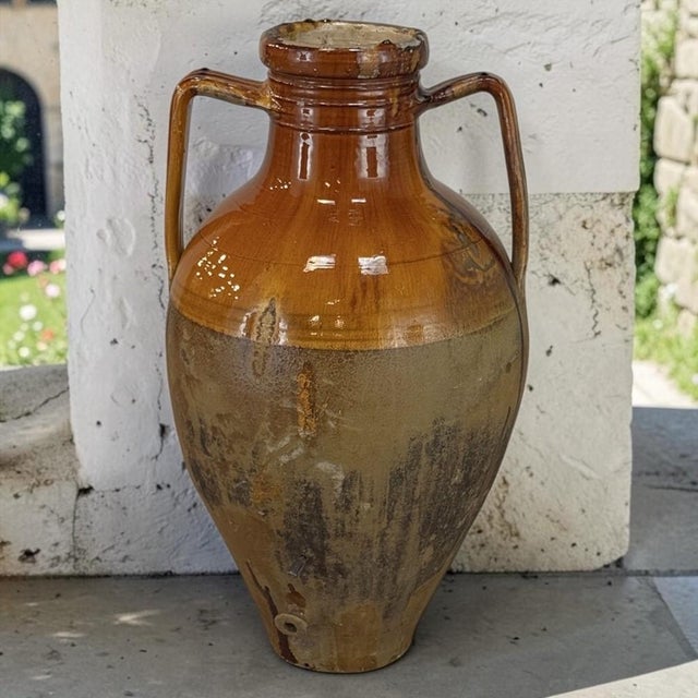 A beautiful relic of traditional Italian country life, this hand-thrown terracotta jar was made for storing and dispensing...
