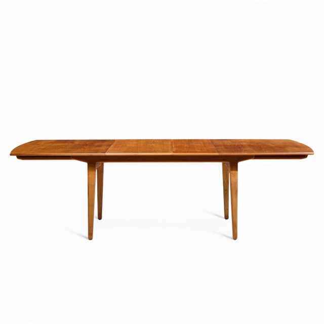 Knud Andersen for JCA Jensen Mid Century Danish Teak Hidden Leaf Dining Table This table measures: 62 wide x 36.5 deep x...