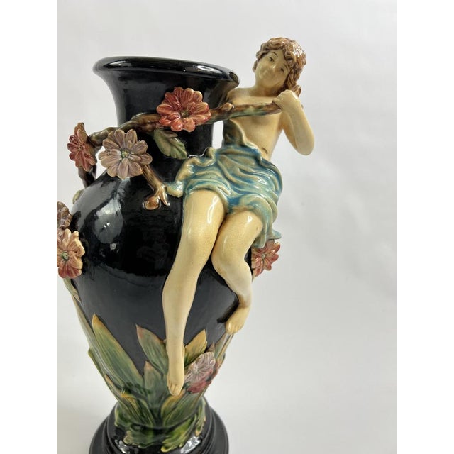 This large slipware vase, signed gl lorraine, unfolds like a living scene frozen in the brilliance of the glazes. a young...