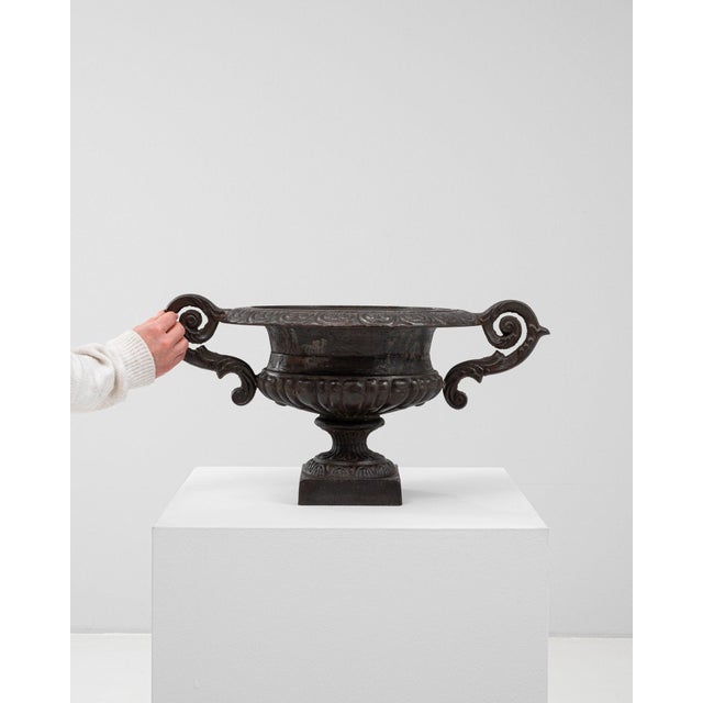 This piece presents as a urn, distinguished by dark bronze/black cast metal, scrolled handles. Dating to 1900s and...